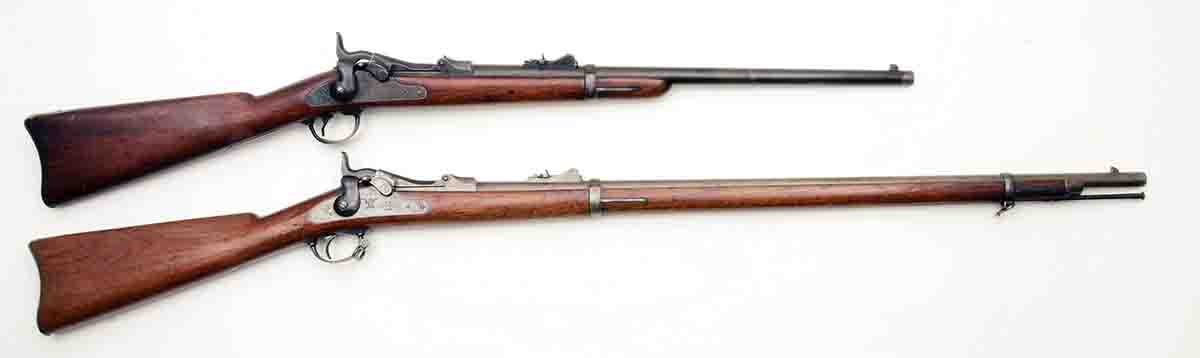 These were introductory firearms for the U.S. government’s .45-70 in 1873. At top is a Model 1873 cavalry carbine, and below it is a Model 1873 infantry rifle.